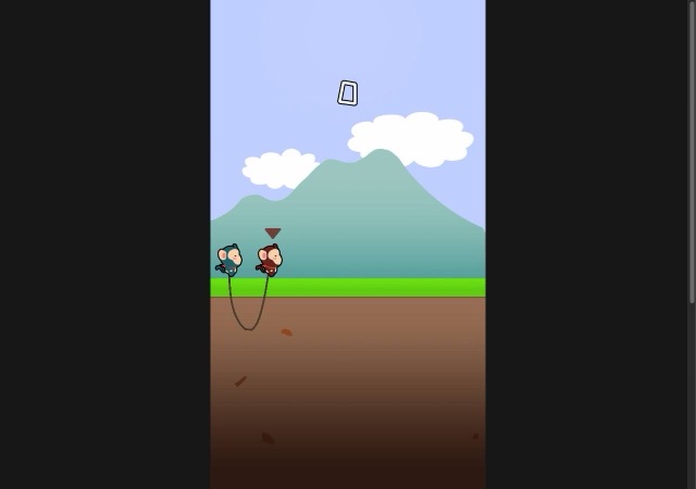 Two rope-linked monkeys on a grassy strip under a mountain after pressing START