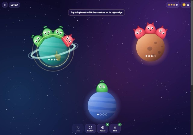 Orbit Pals Level 1 with three planets, alien pals, tutorial banner and bottom toolbar