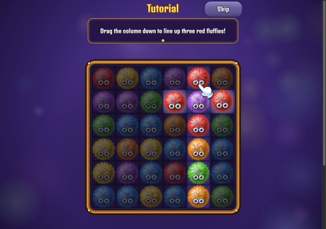 Tutorial screen with a grid of furry colored creatures and a hint to line up three red ones